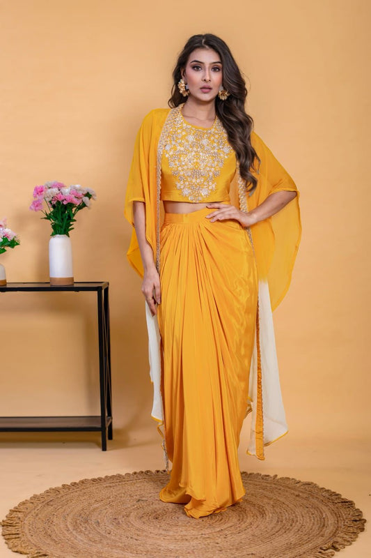 This three-piece mustard yellow Indo-Western skirt set with cape is the perfect festive wear.